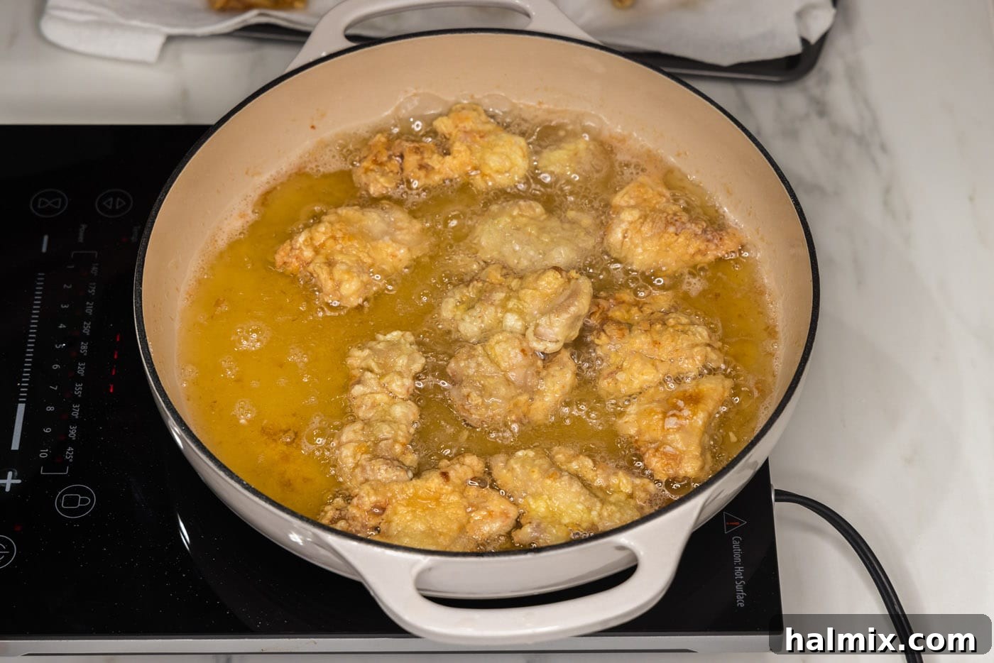 chicken frying in oil