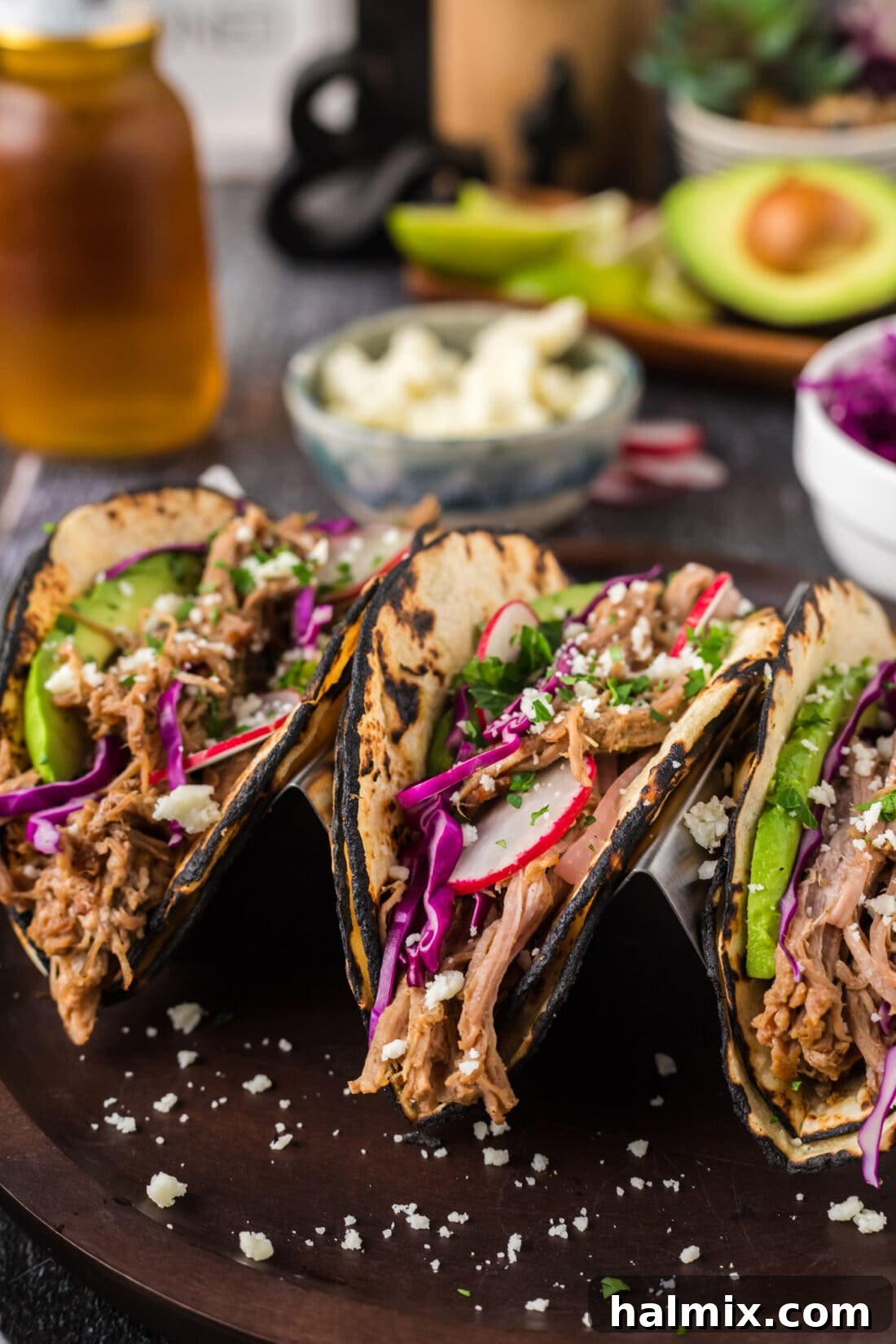 Mouthwatering Pulled Pork Tacos 2 Close up photo of three Pulled Pork Tacos on a plate