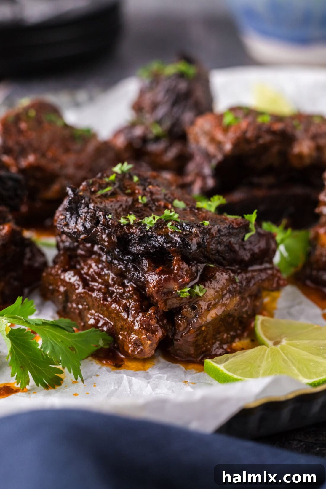 Close-up shot of a perfectly braised Mexican Short Rib, glistening with sauce and ready to be enjoyed.