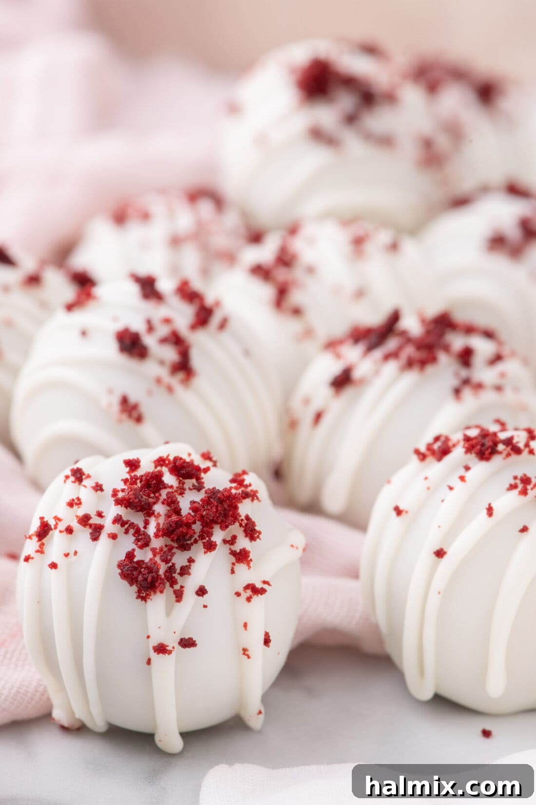 Close up photo of beautifully coated Red Velvet Cake Balls on a platter