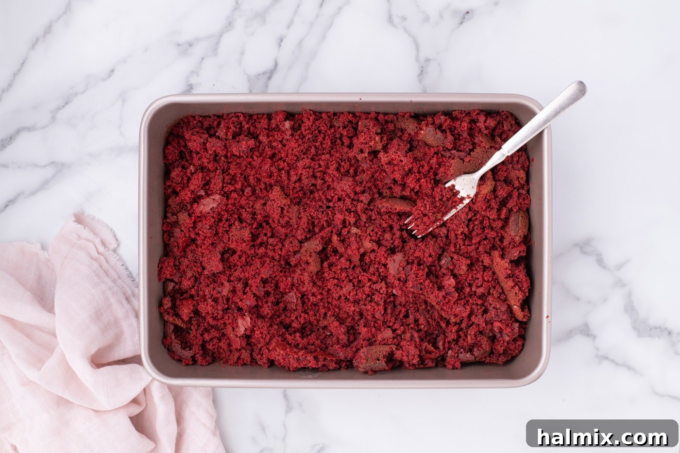 Crumbled red velvet cake in a baking dish