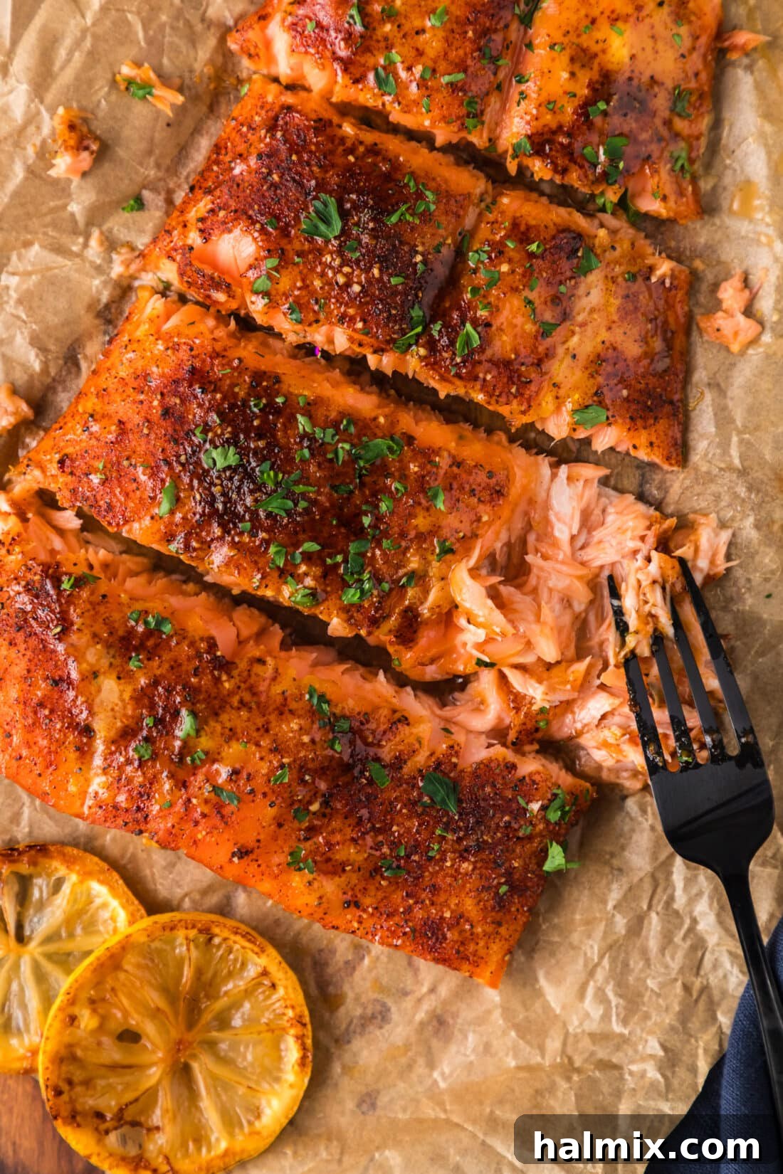 The Smoked Salmon Experience 2 Fork pulling apart a filet of Smoked Salmon, showcasing its flaky texture