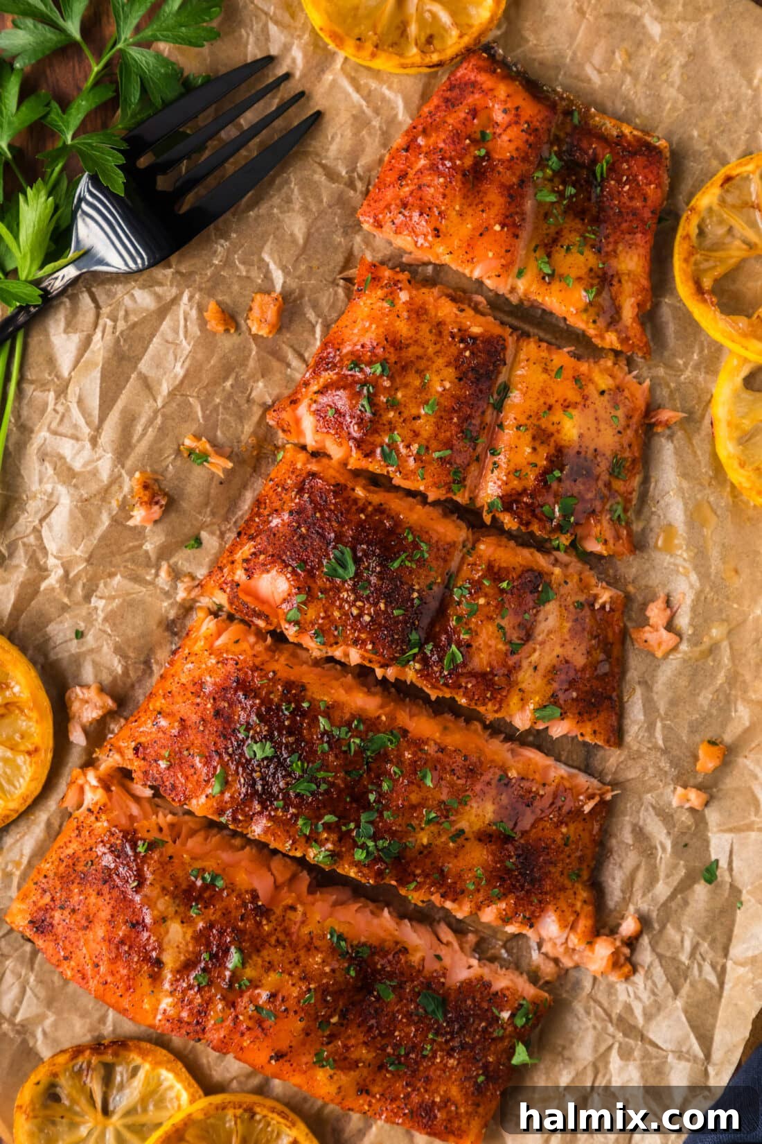 The Smoked Salmon Experience 3 Fresh salmon fillets cut and resting on parchment paper, ready for smoking