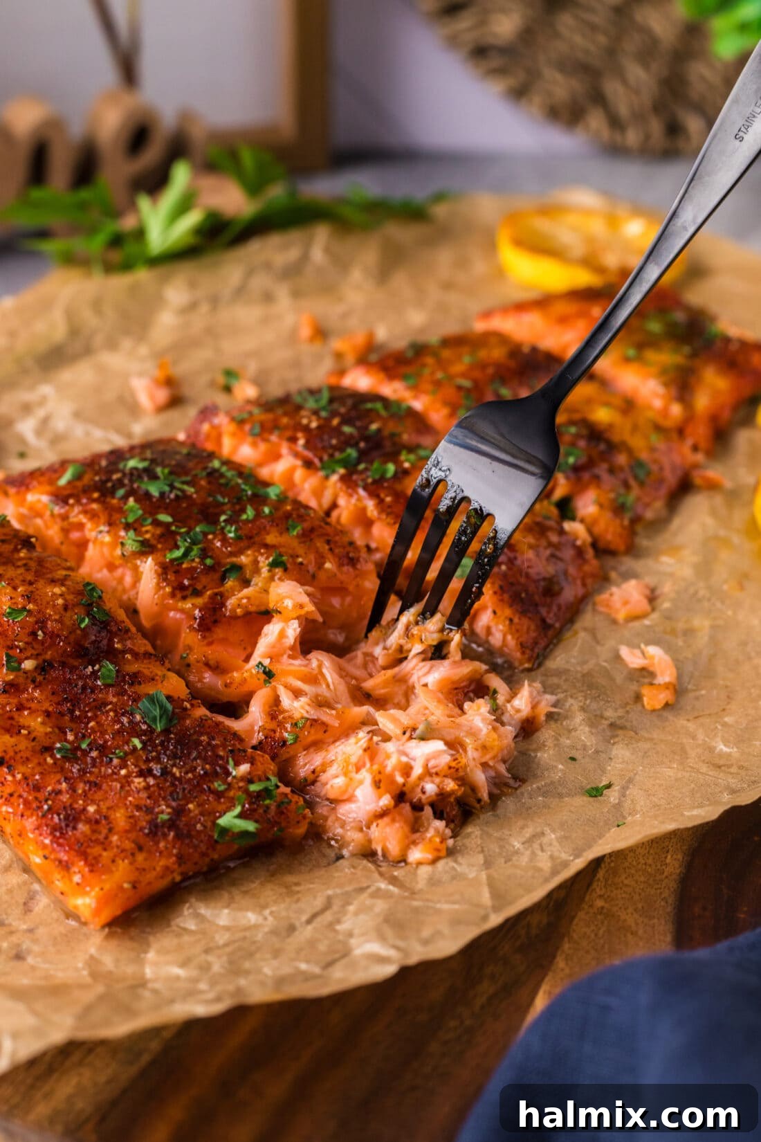 The Smoked Salmon Experience 10 A fork gently pulling apart a piece of perfectly smoked salmon, highlighting its tender and moist interior