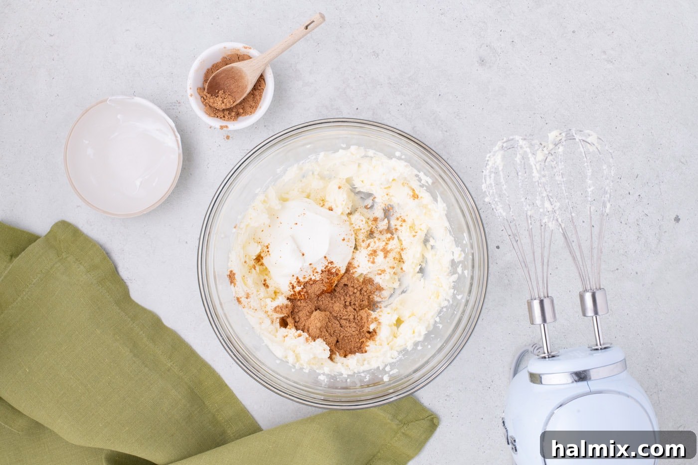 sour cream, taco seasoning, and cream cheese in a mixing bowl