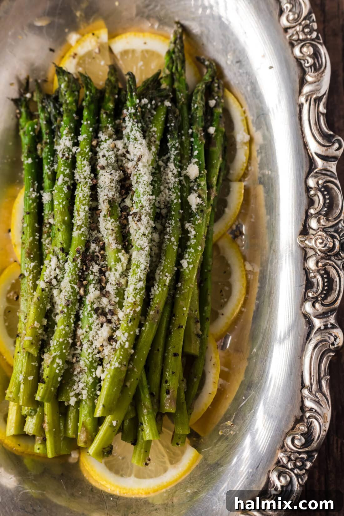 Spring's Tender Green Spears 6 Close up photo of Steamed Asparagus topped with parmesan