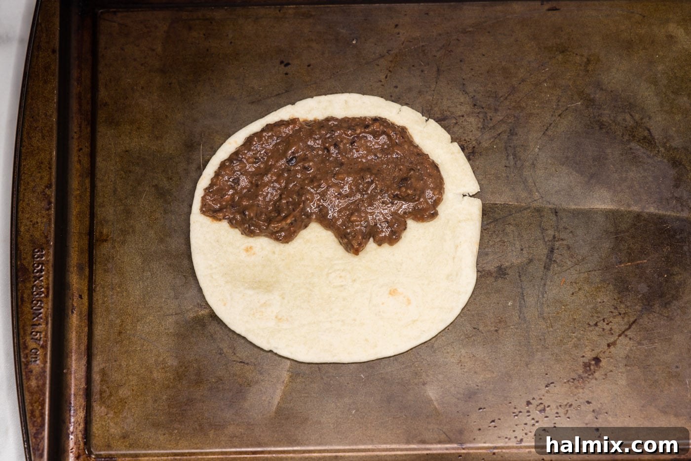 black bean mixture spread over tortilla